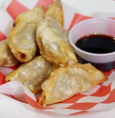 Fried beef dumplings with soy dipping sauce